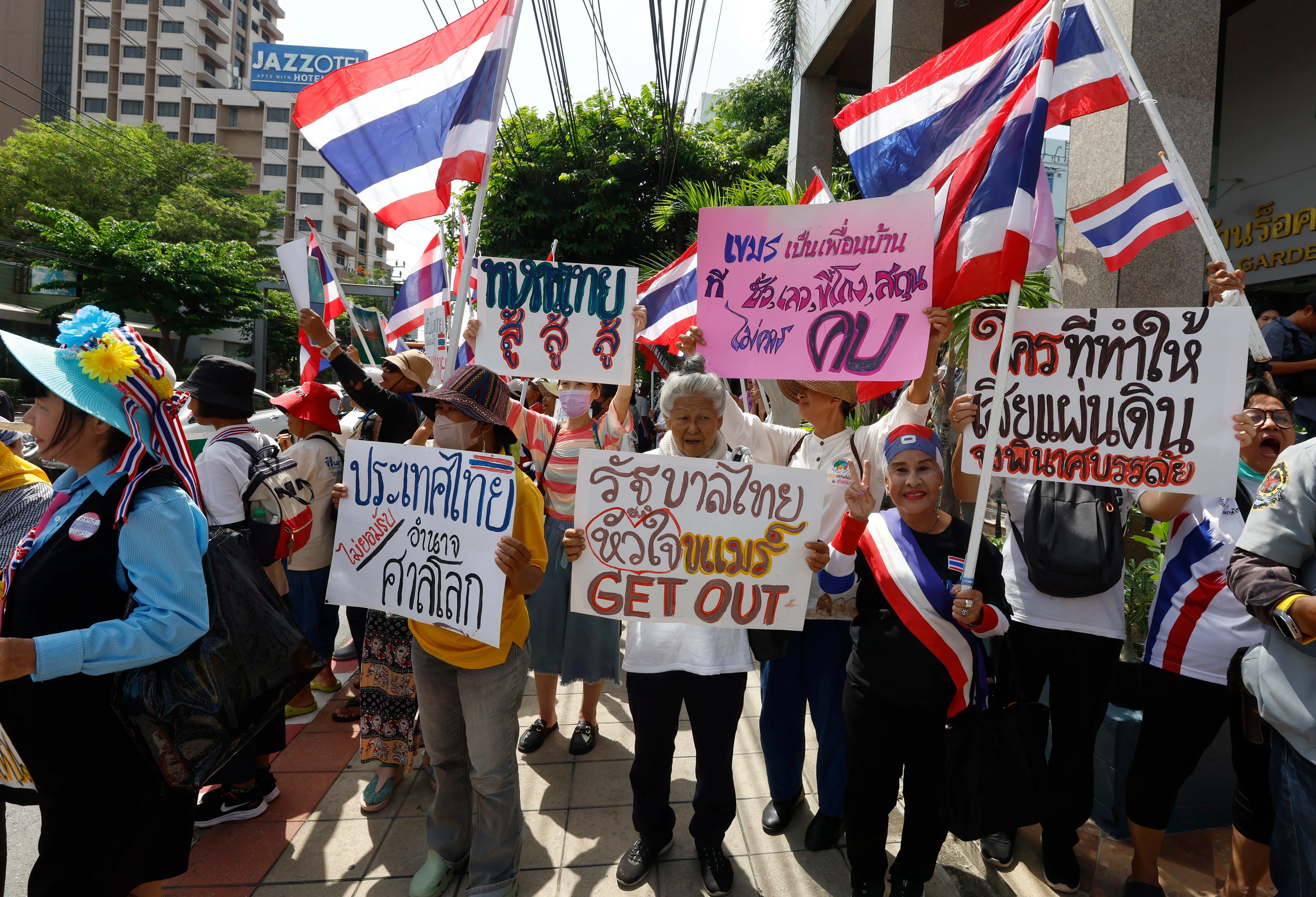 Thai nationalists hold national flags as they gather outside the Cambodian Embassy to protest over t
